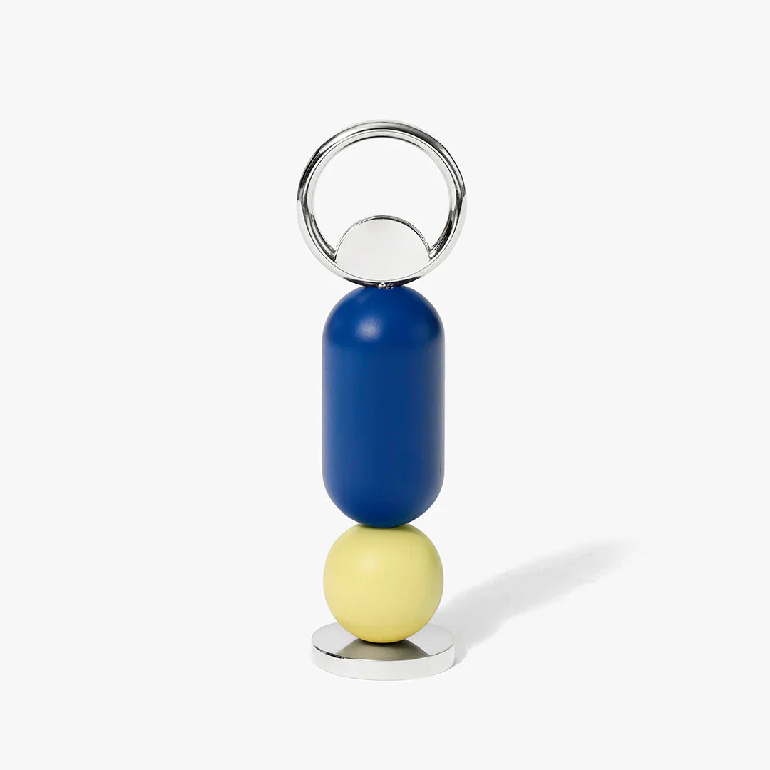 Bottle opener with blue and yellow beads on a white background