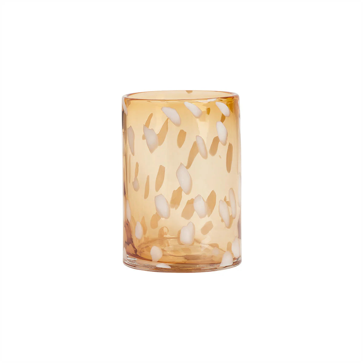 Decorative glass vase with dot pattern on a white background