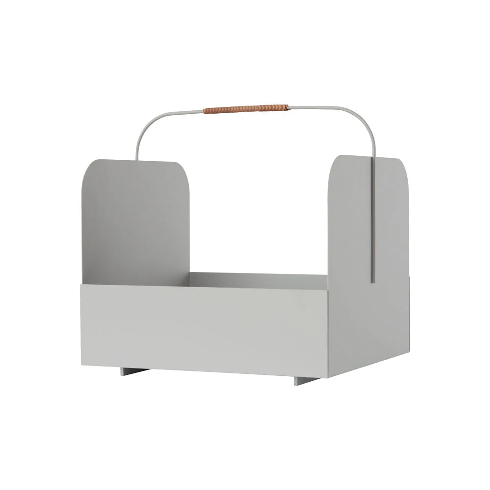 Gray magazine rack with a wooden handle on a white background