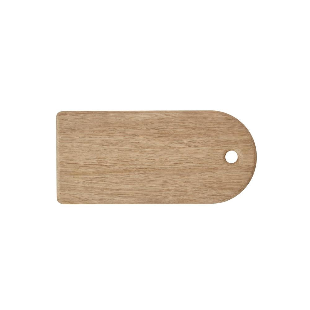 Wooden cutting board with a rounded handle laid flat on a white background