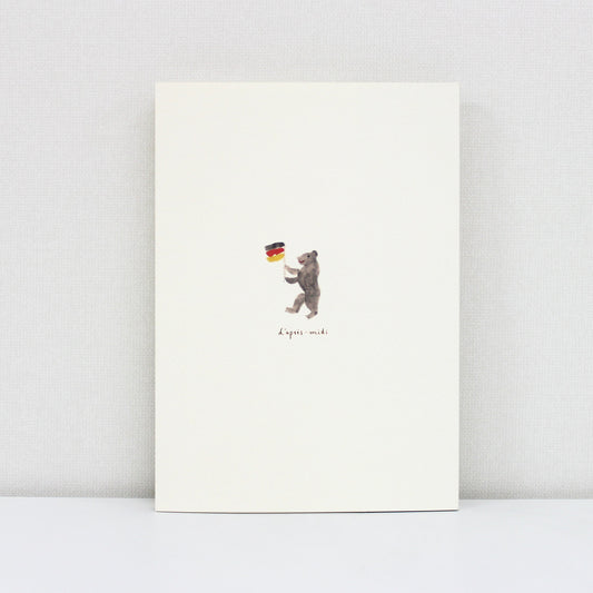 Notebook with a bear holding a German flag on a white background
