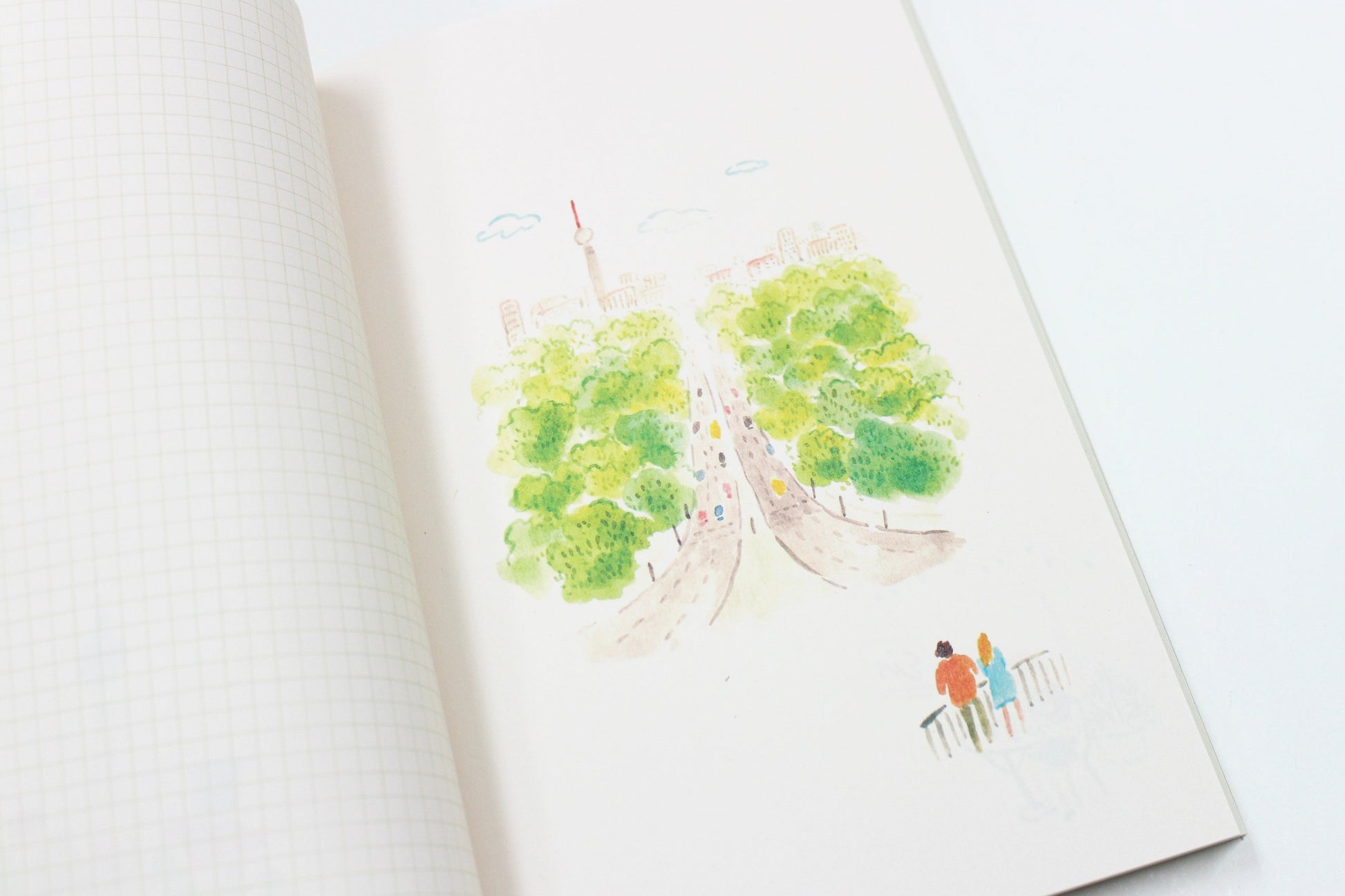 Illustration of a park with trees and people on a notebook