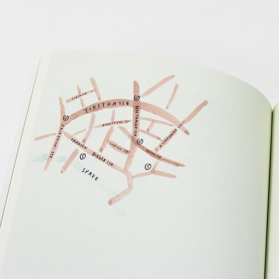 Open book with a map of a city on a white background