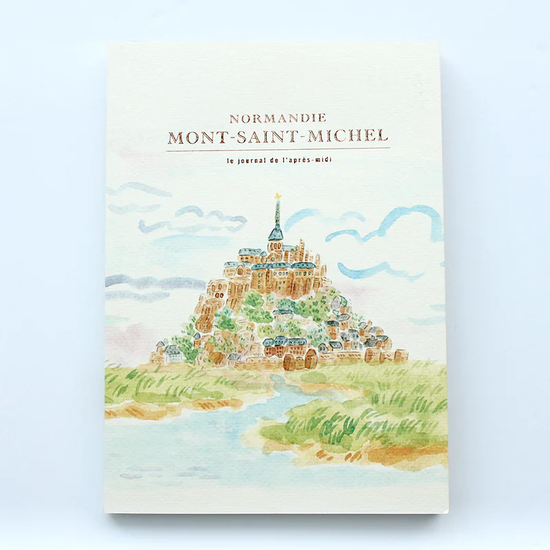 Notebook with illustration of Mont-Saint-Michel on a light blue background