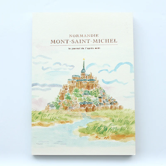 Notebook with illustration of Mont-Saint-Michel on a light blue background