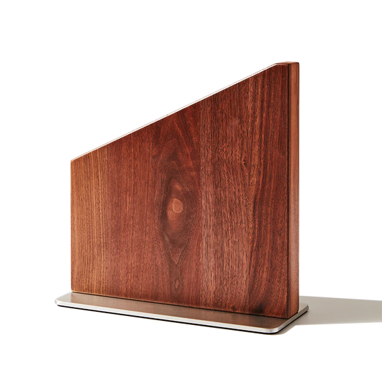 Wooden magnetic knife stand on a white background