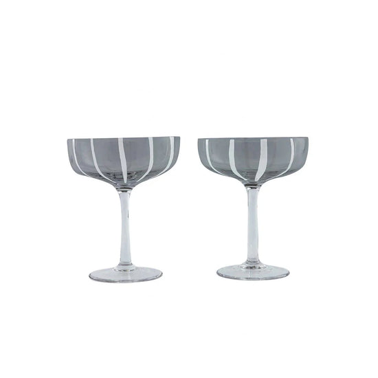 Two striped cocktail glasses on a white background