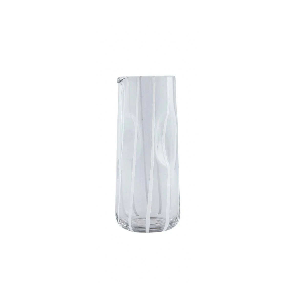 Clear water carafe with wavy design on a white background