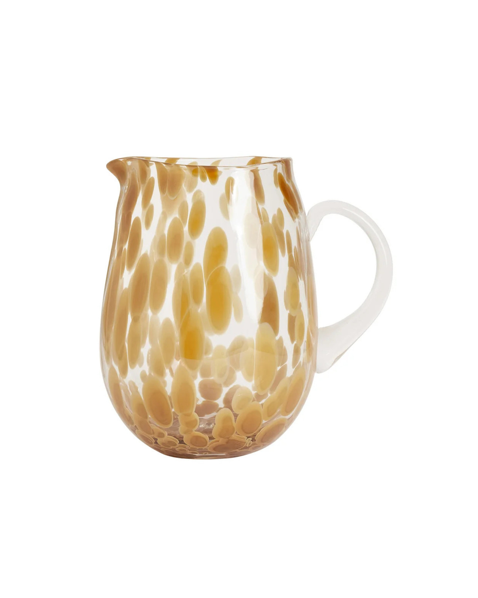 Glass mug with brown and white abstract pattern on a white background