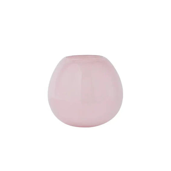 Pink spherical vase on a white background