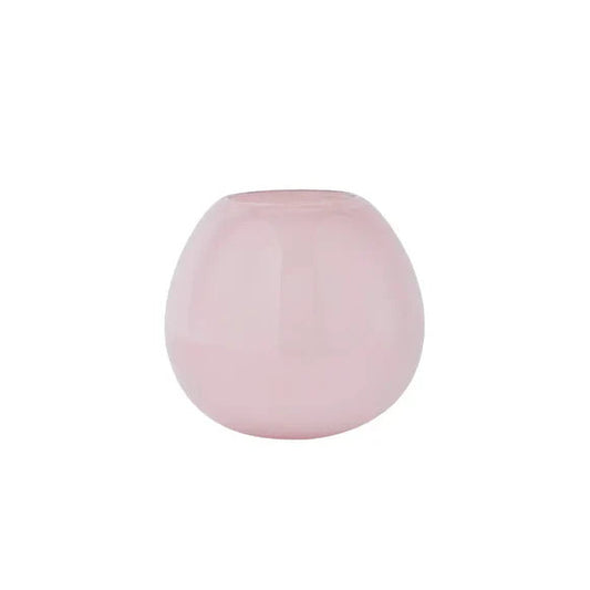 Pink spherical vase on a white background