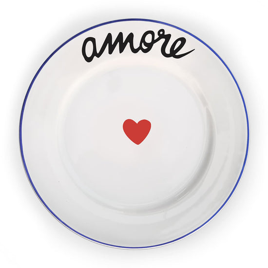 White plate with blue rim, red heart, and black 'amore' text on a white background