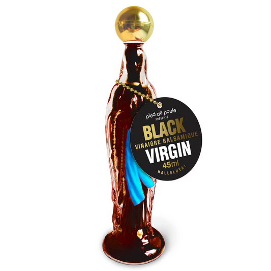 Balsamic vinegar bottle with a gold cap and black label on a white background