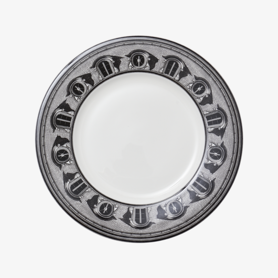White plate with decorative black rim on a white background