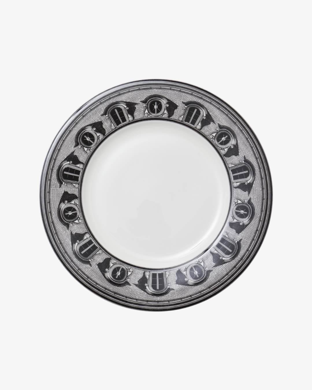 White plate with decorative black rim on a white background