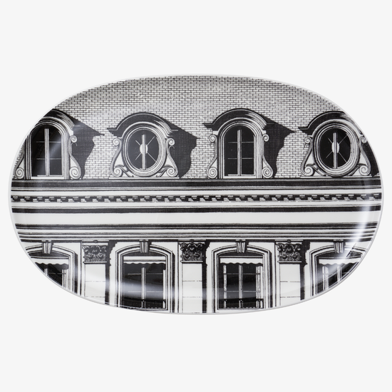 Decorative plate with black and white architectural design on a white background