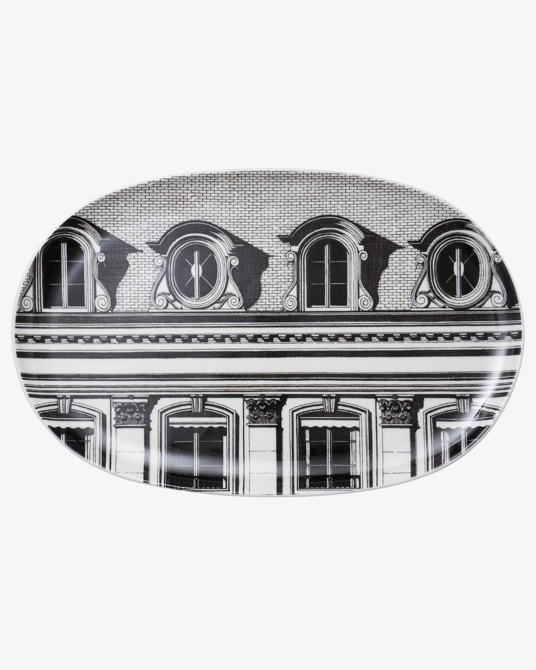 Decorative plate with black and white architectural design on a white background