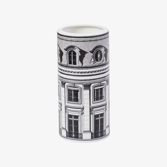 Cylindrical vase with black and white architectural design on a white background