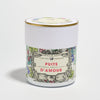A jar with a floral illustrated label reading “Puits d’Amour” on a white background