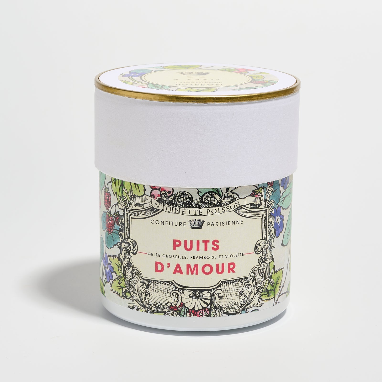 A jar with a floral illustrated label reading “Puits d’Amour” on a white background