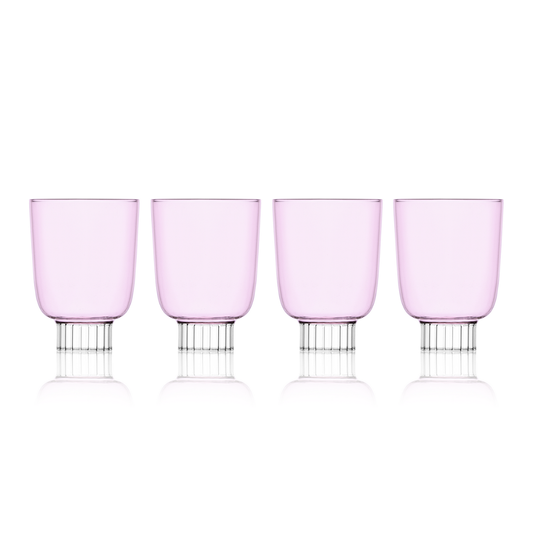 Four pink wine glasses with silver bases on a white background