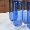 Detailed close up photo of blue Champagne glass