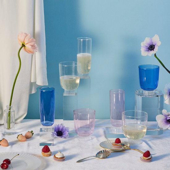 drinkware with flower on blue background