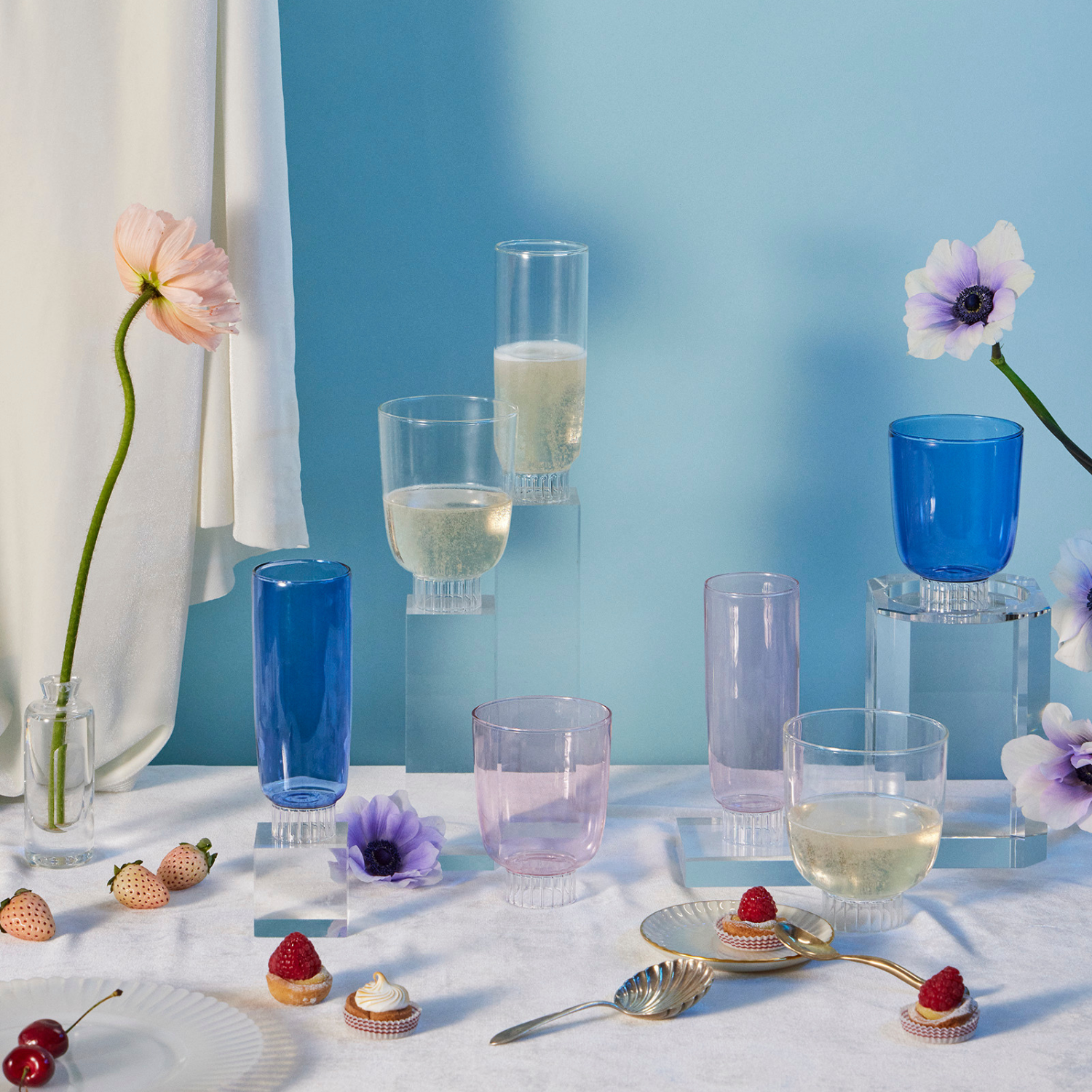 drinkware with flower on blue background
