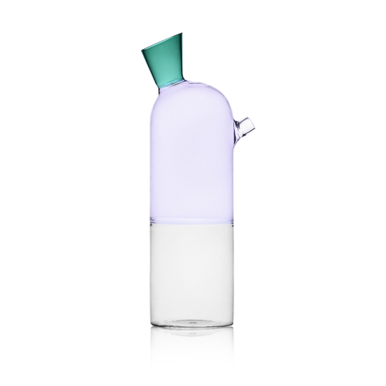 Clear glass carafe with a purple base and green lid on a white background