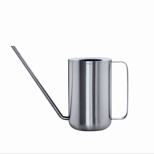 Stainless steel watering can on a white background