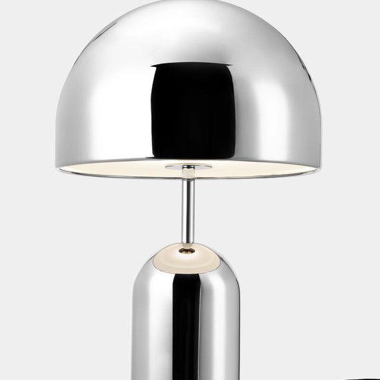 Chrome table lamp on a white background