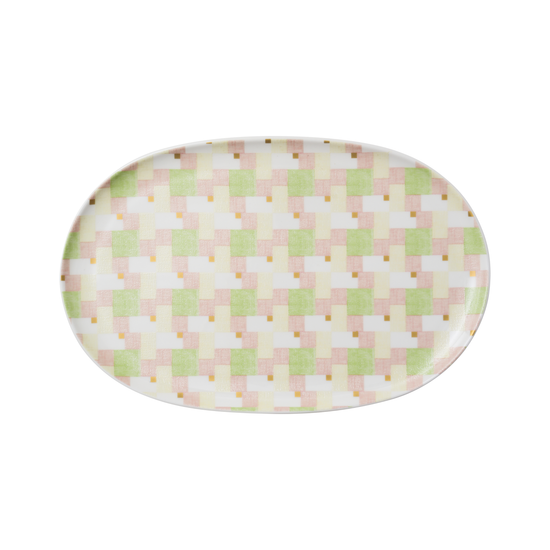 Oval-shaped plate with a pastel checkered pattern on a white background