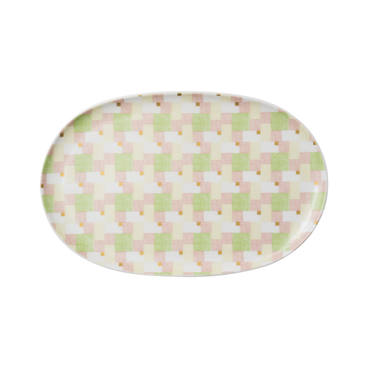 Oval-shaped plate with a pastel checkered pattern on a white background