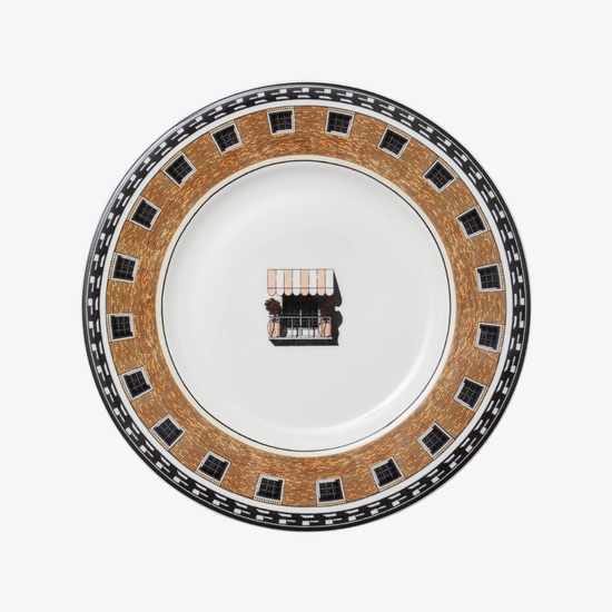 Decorative plate with a central design on a white background