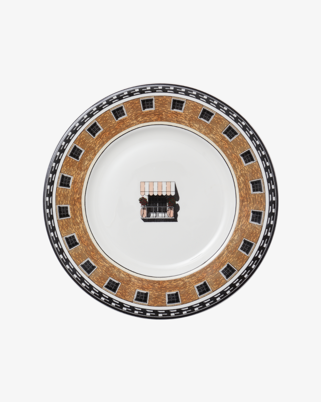 Decorative plate with a central design on a white background