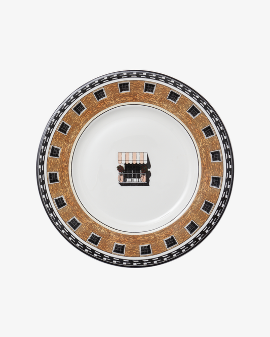 Decorative plate with a central design on a white background