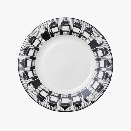 White plate with black geometric pattern on a white background