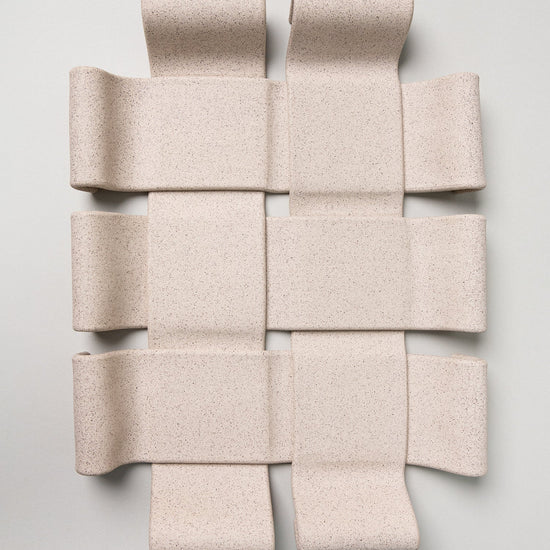 Beige woven acoustic panel on a light gray background