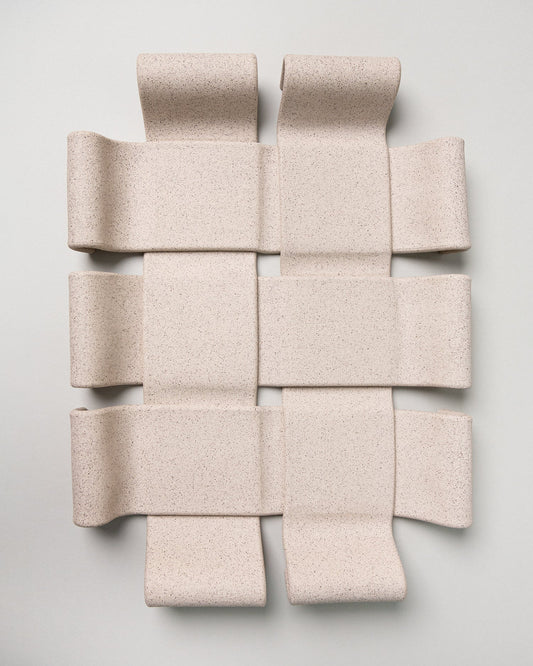 Beige woven acoustic panel on a light gray background