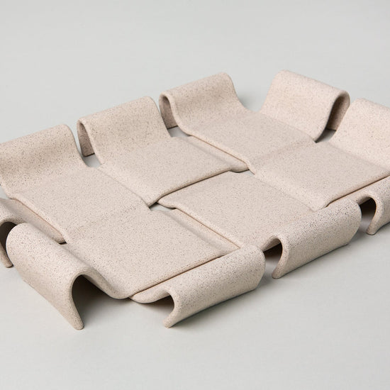 Beige modular sofa on a light gray background