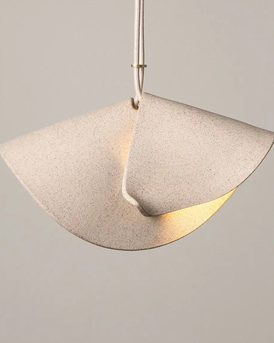 Pendant light with a concrete-like finish on a neutral background