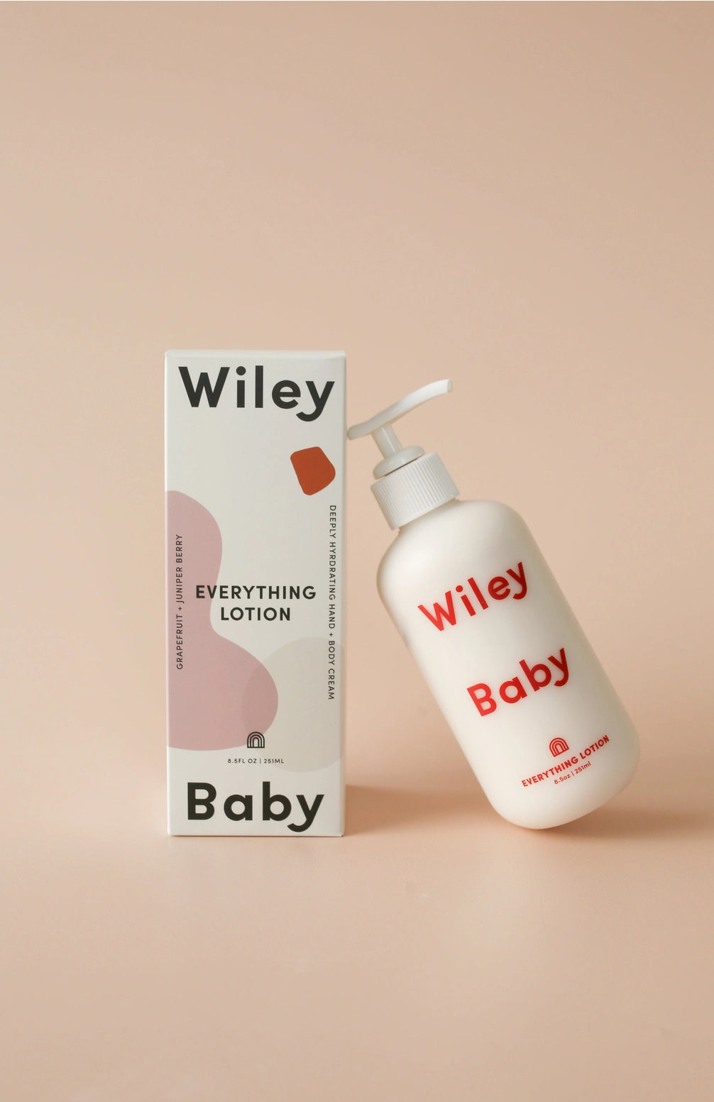 Wiley Baby lotion bottle and packaging on a beige background